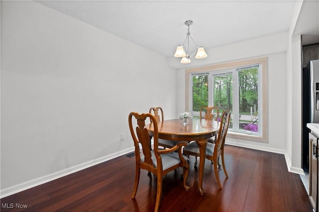 5550 Barton Rd, North Olmsted, OH 44070 - dining space with baseboards, a chandelier, and dark wood finished floors