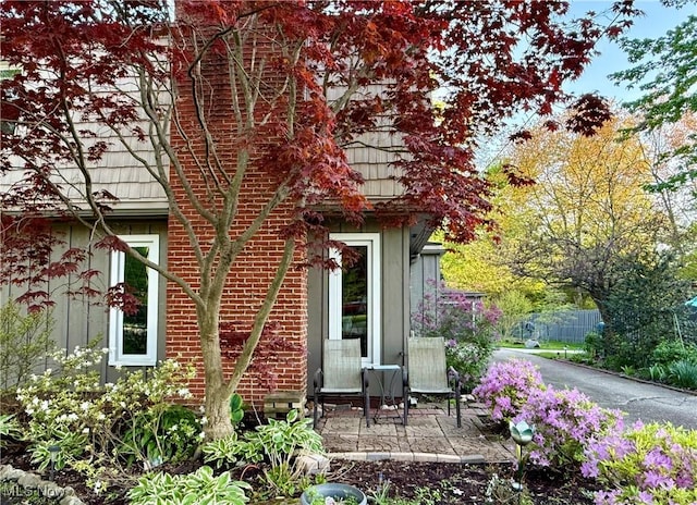 5550 Barton Rd, North Olmsted, OH 44070 - view of side of home featuring a patio