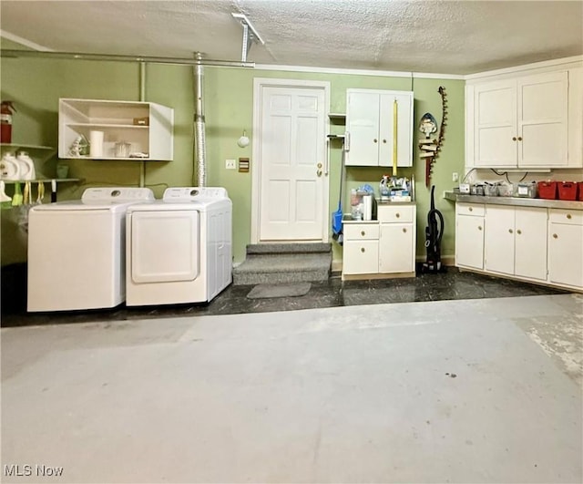 45 Meadowcrest Dr, Parkersburg, WV 26104 - laundry area featuring independent washer and dryer, cabinet space, and a textured ceiling