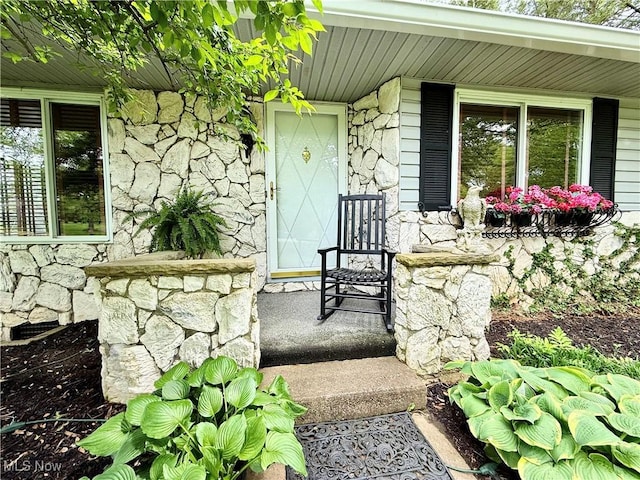 45 Meadowcrest Dr, Parkersburg, WV 26104 - view of exterior entry with stone siding and a porch