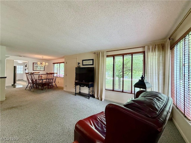 45 Meadowcrest Dr, Parkersburg, WV 26104 - living area with a textured ceiling, a chandelier, baseboards, and carpet