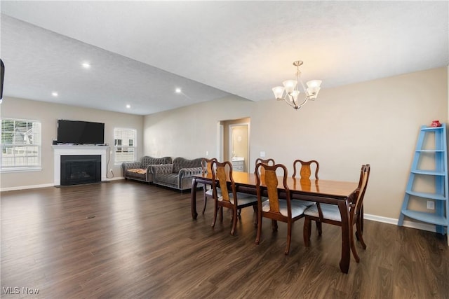 2273 Cranberry Creek Rd, Ravenna, OH 44266 - dining space featuring a chandelier, dark wood-type flooring, baseboards, recessed lighting, and a fireplace with flush hearth
