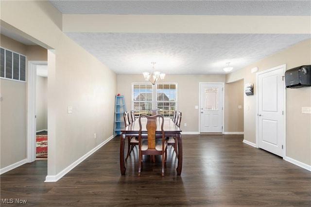 2273 Cranberry Creek Rd, Ravenna, OH 44266 - dining room with a chandelier, dark wood-style floors, baseboards, and a textured ceiling