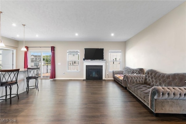 2273 Cranberry Creek Rd, Ravenna, OH 44266 - living area featuring dark wood-style flooring, recessed lighting, baseboards, and a glass covered fireplace