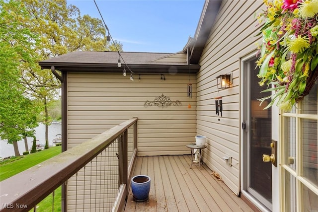 deck featuring a water view