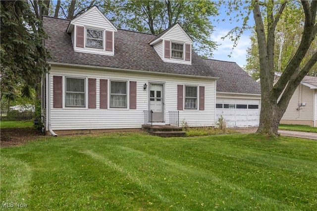 cape cod-style house featuring a front lawn, an attached garage, roof with shingles, and driveway