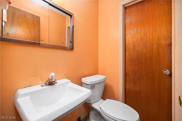 bathroom with a sink and toilet