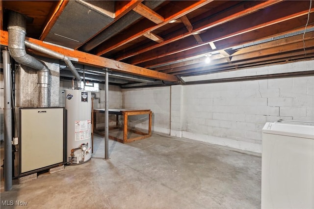 unfinished basement with gas water heater and washer / dryer