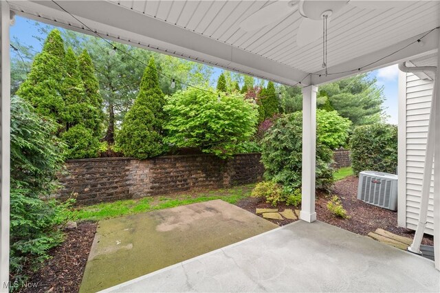 view of patio with cooling unit and ceiling fan