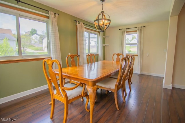 53350 High Ridge Rd, Bridgeport, OH 43912 - dining space with a chandelier, baseboards, and dark wood-type flooring