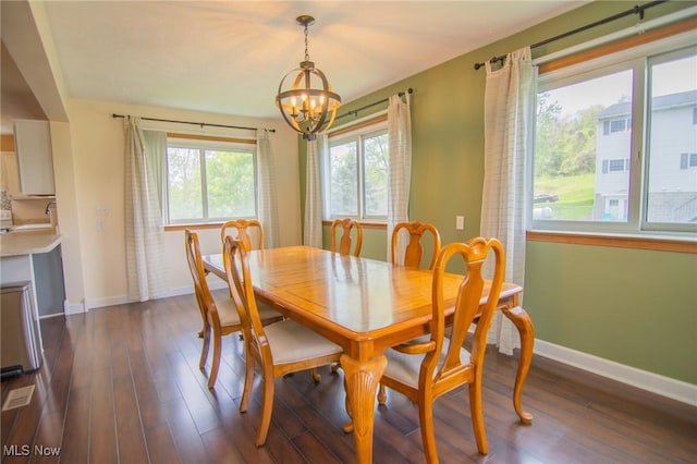 53350 High Ridge Rd, Bridgeport, OH 43912 - dining area with a chandelier, baseboards, and dark wood-style flooring