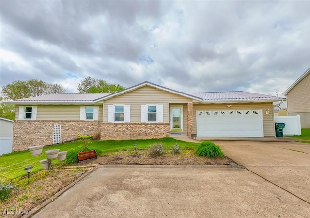 53350 High Ridge Rd, Bridgeport, OH 43912 - ranch-style house with brick siding, a garage, concrete driveway, metal roof, and a front yard