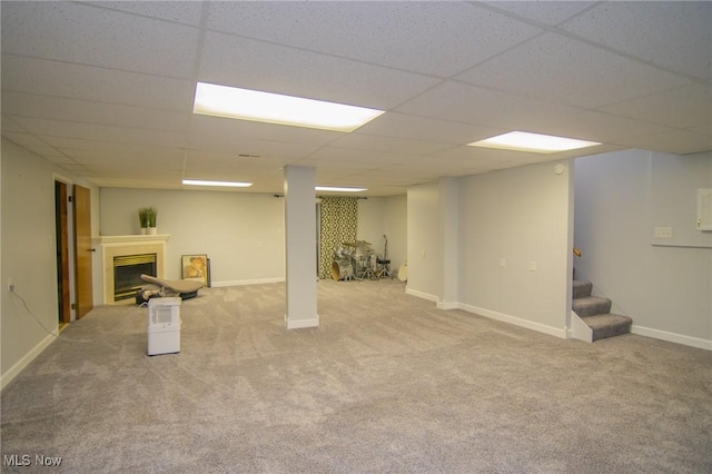 53350 High Ridge Rd, Bridgeport, OH 43912 - finished basement with carpet floors, stairs, a paneled ceiling, a fireplace, and baseboards