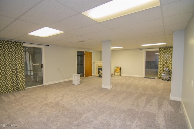 53350 High Ridge Rd, Bridgeport, OH 43912 - finished basement featuring carpet floors, a paneled ceiling, a fireplace, and baseboards