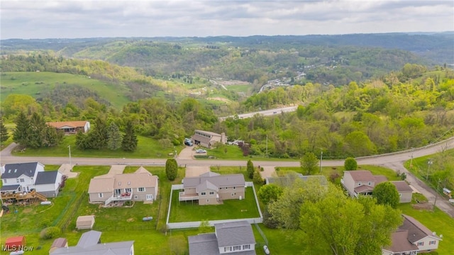 53350 High Ridge Rd, Bridgeport, OH 43912 - aerial overview of property's location featuring nearby suburban area and a forest