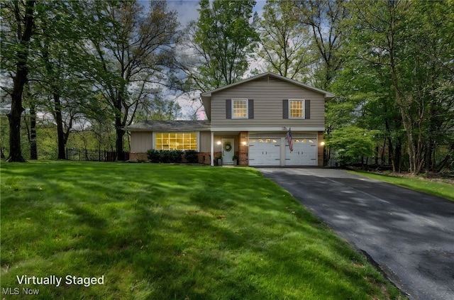 7805 Skylineview Dr, Mentor, OH 44060 - view of front facade featuring driveway and a garage