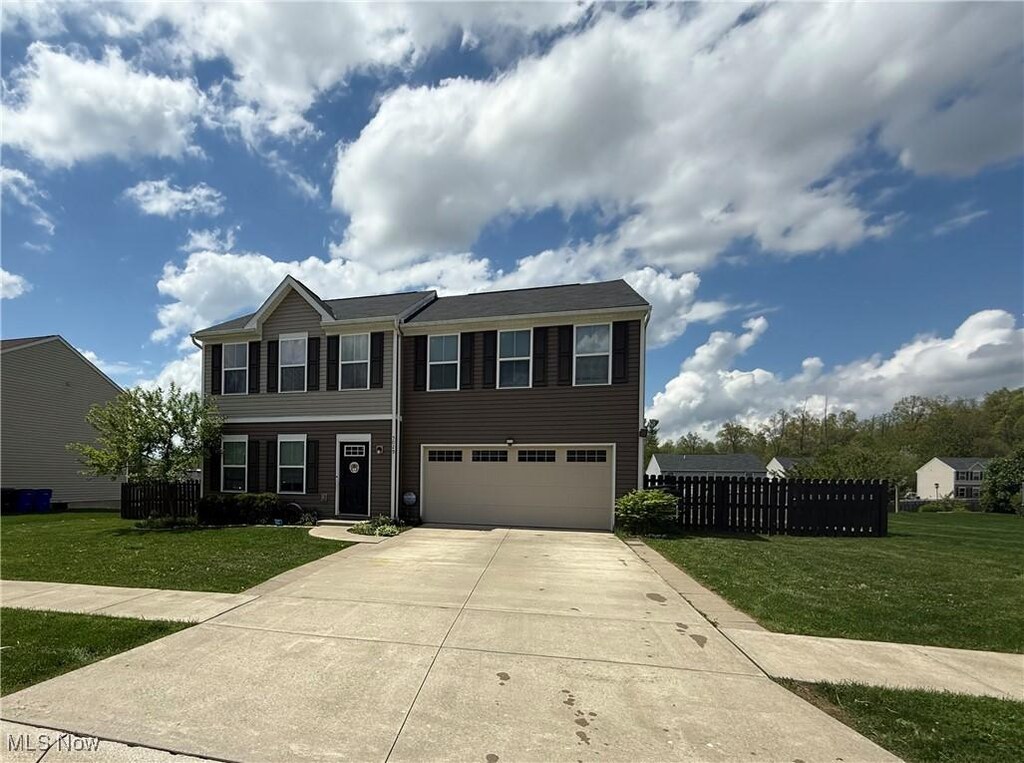 5029 Blackberry Ln, Ravenna, OH 44266 - view of front of home with a garage and concrete driveway