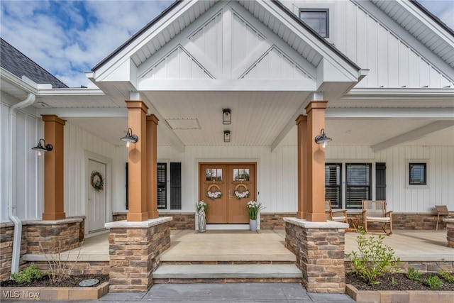 7440 Thatchum Ln, Concord, OH 44077 - property entrance featuring covered porch and board and batten siding
