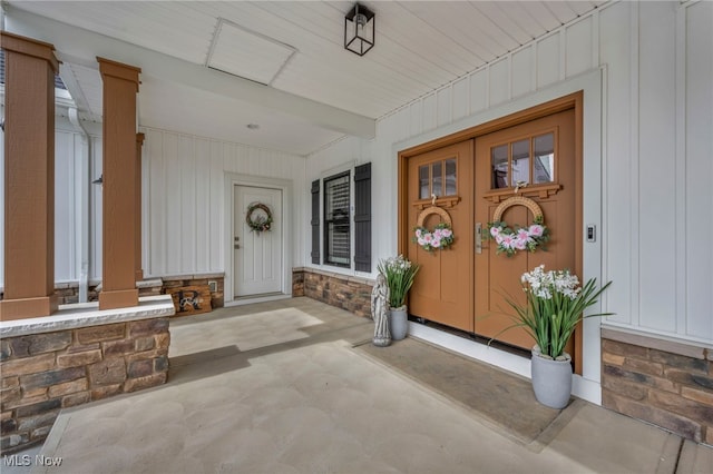 7440 Thatchum Ln, Concord, OH 44077 - entrance to property with a porch, board and batten siding, and stone siding