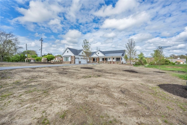 7440 Thatchum Ln, Concord, OH 44077 - view of front of house featuring metal roof
