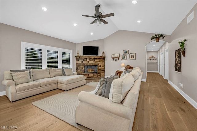 7440 Thatchum Ln, Concord, OH 44077 - living area featuring ceiling fan, lofted ceiling, baseboards, wood finished floors, and arched walkways