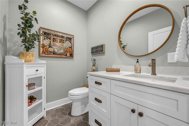 7440 Thatchum Ln, Concord, OH 44077 - bathroom featuring toilet, vanity, baseboards, and tile patterned flooring