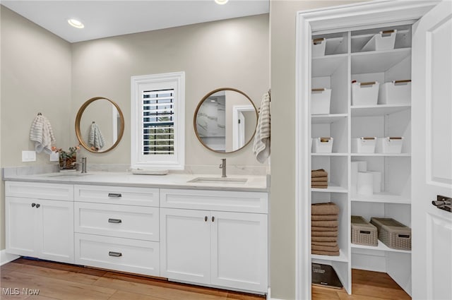 7440 Thatchum Ln, Concord, OH 44077 - full bathroom with wood finished floors and double vanity