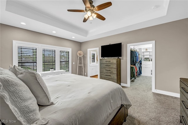 7440 Thatchum Ln, Concord, OH 44077 - bedroom with a raised ceiling, light carpet, a walk in closet, baseboards, and recessed lighting