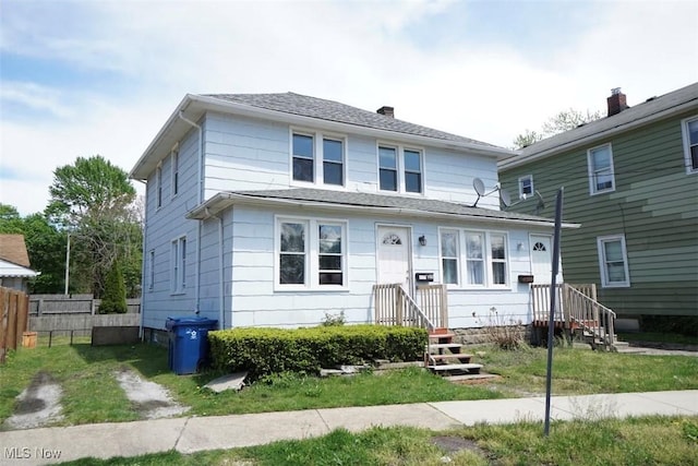 396 Railroad St, Painesville, OH 44077 - american foursquare style home featuring fence and a chimney