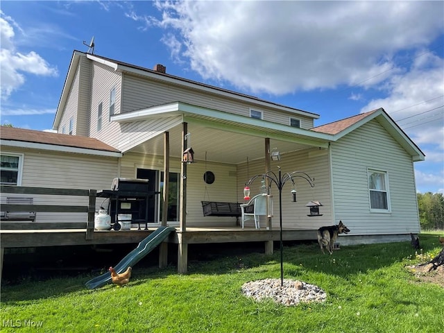 9207 Plank Rd, North Bloomfield, OH 44450 - back of house featuring a lawn, a porch, and a chimney