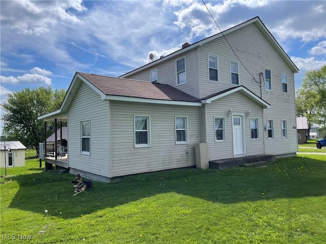 9207 Plank Rd, North Bloomfield, OH 44450 - back of house with a yard