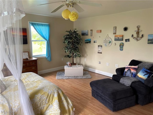 9207 Plank Rd, North Bloomfield, OH 44450 - bedroom featuring wood finished floors, baseboards, and ceiling fan