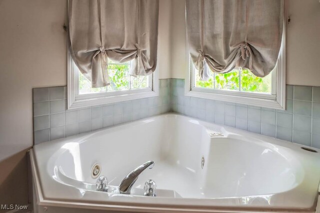 full bath featuring a whirlpool tub