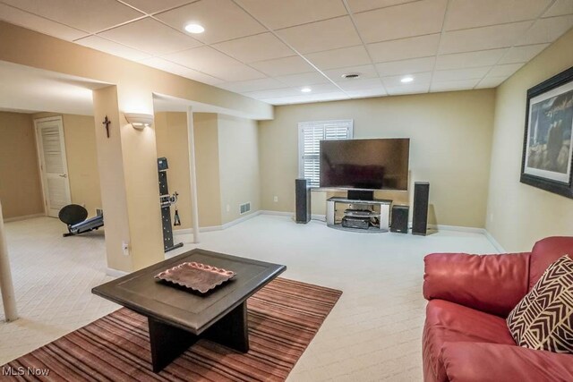 living room with carpet flooring, a paneled ceiling, baseboards, and recessed lighting