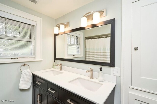 full bath featuring double vanity
