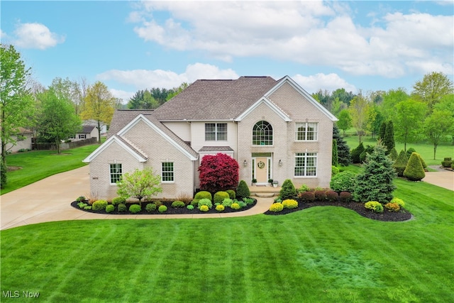 6972 Stagecoach Trl, Valley City, OH 44280 - view of front of property with a front lawn, driveway, and brick siding