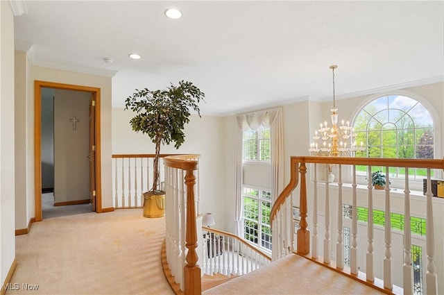 6972 Stagecoach Trl, Valley City, OH 44280 - hallway featuring an upstairs landing, a chandelier, baseboards, crown molding, and carpet flooring