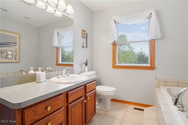 6972 Stagecoach Trl, Valley City, OH 44280 - full bathroom with tile patterned flooring, vanity, baseboards, tiled tub, and toilet