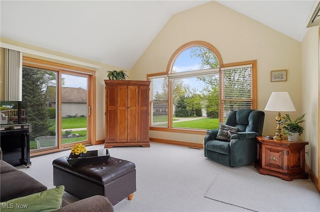 6972 Stagecoach Trl, Valley City, OH 44280 - living area featuring plenty of natural light, light carpet, baseboards, and high vaulted ceiling