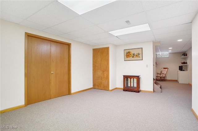6972 Stagecoach Trl, Valley City, OH 44280 - finished below grade area featuring carpet flooring, a paneled ceiling, and baseboards