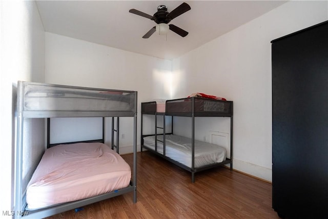 1016 12th St NE, Canton, OH 44704 - bedroom with wood finished floors, ceiling fan, and baseboards