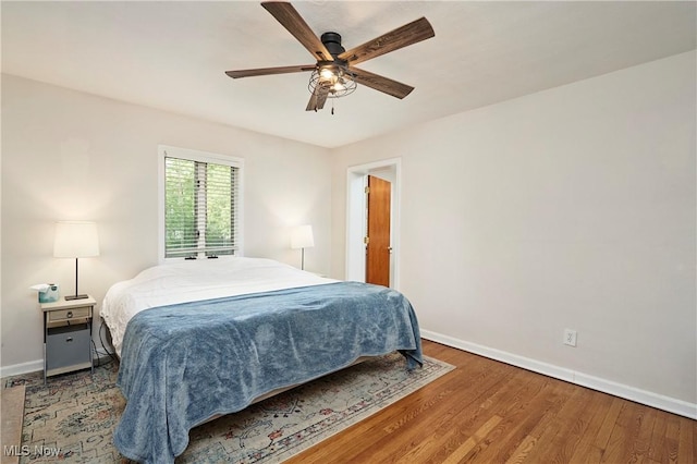2530 Holgate Rd, Akron, OH 44313 - bedroom with baseboards, wood finished floors, and ceiling fan