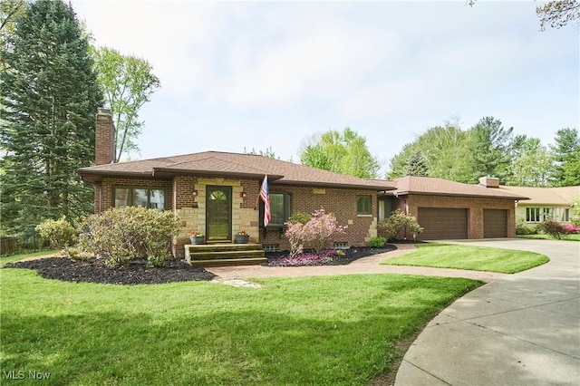 2530 Holgate Rd, Akron, OH 44313 - view of front of property featuring a garage, a chimney, concrete driveway, and a front yard