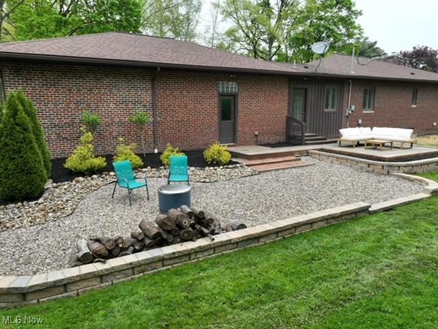 2530 Holgate Rd, Akron, OH 44313 - rear view of property featuring a patio area, brick siding, a yard, and a deck