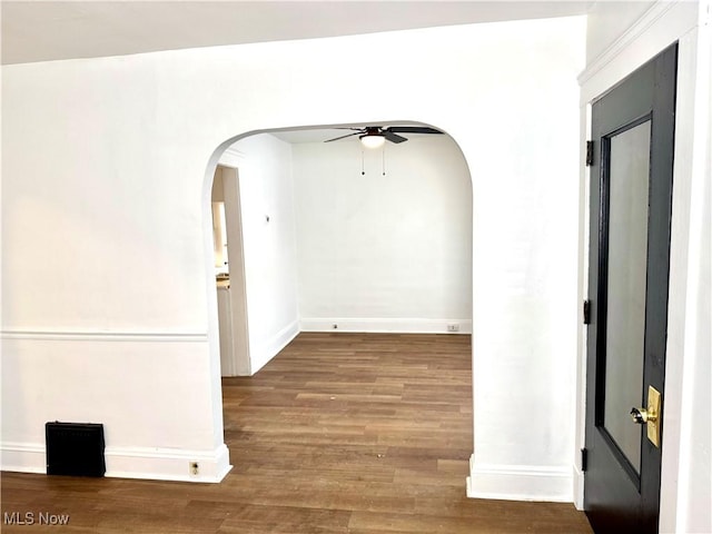 3631 E 104th St, Cleveland, OH 44105 - hallway with arched walkways, wood finished floors, and baseboards