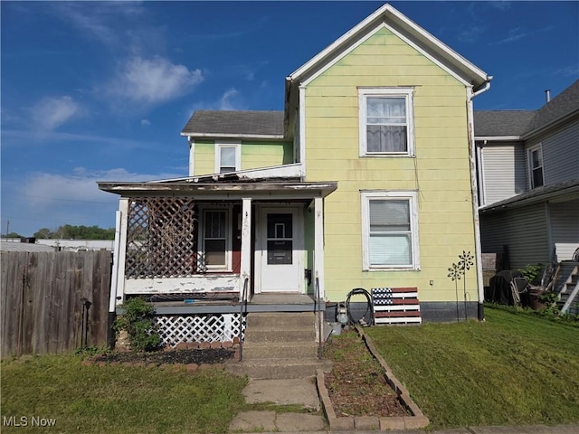 view of front facade featuring a porch and roof with shingles