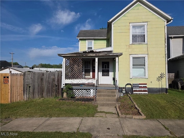 view of front of house with a porch and a shingled roof