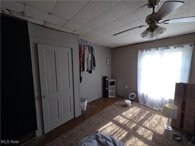 bedroom featuring wood finished floors and ceiling fan