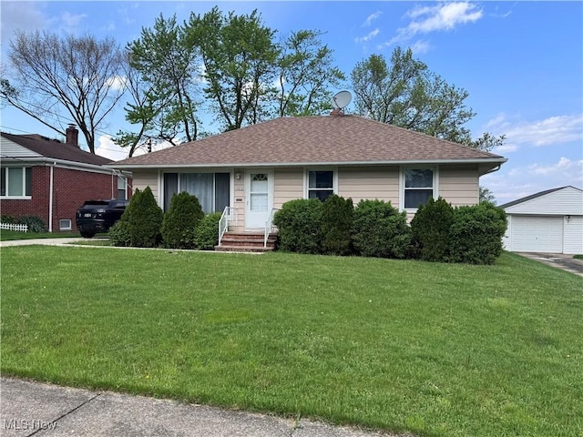 1422 Lorimer Rd, Parma, OH 44134 - bungalow-style house with a front yard, a garage, an outdoor structure, and a shingled roof