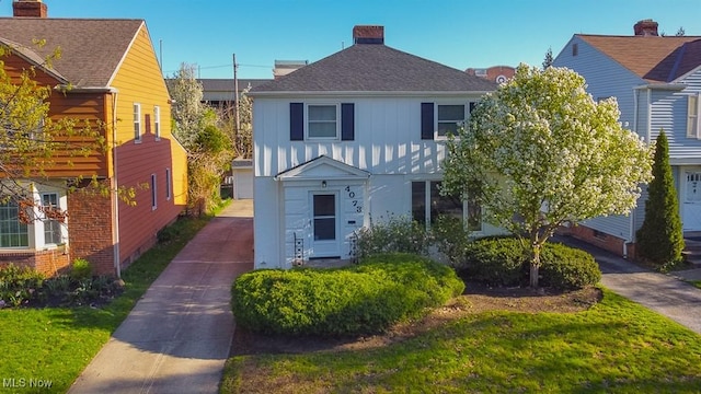 4073 Bushnell Rd, University Heights, OH 44118 - view of front of house with board and batten siding and a shingled roof